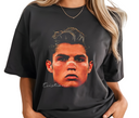 Black t-shirt with a graphic of a person's face and 'Cristiano' text, worn by a person.