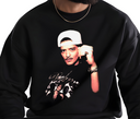 Man wearing black Velvet Showman sweatshirt retro singer fan apparel.