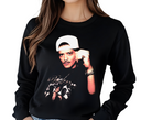 Woman styling black Velvet Showman long sleeve, casual unisex music shirt.