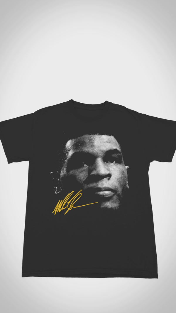 Vintage Mike Tyson T-shirt - Close-up video shows heavyweight 100% cotton, distressed 1980s fight graphics, and 'Baddest Man on the Planet' text for boxing collectors.
