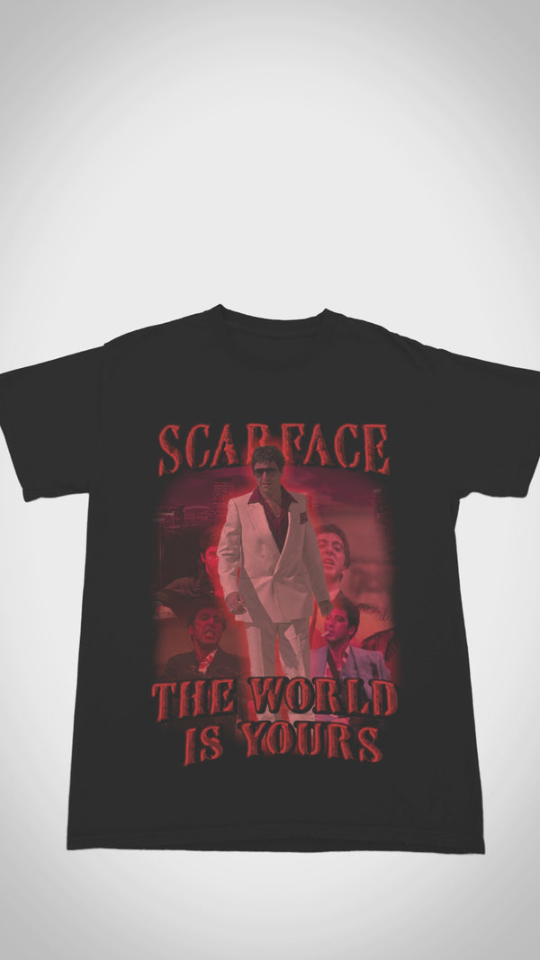 Vintage Scarface 'The World Is Yours' T-shirt - Close-up video shows heavyweight 100% cotton, distressed 2006 game graphics, and cracked Tony Montana artwork for gaming/hip-hop collectors.