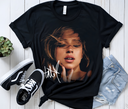 Black Tate McRae Greedy tee mockup styled with sneakers, urban streetwear.